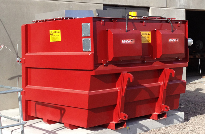 Red BEAF mobile filter separator placed on an industrial site, designed for easy front-loader transport and capable of handling large volumes of dust, ash, or sticky materials.